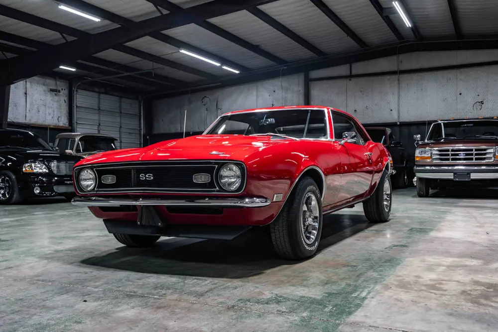 Classic and muscle cars lined up at the Cityway Autos showroom